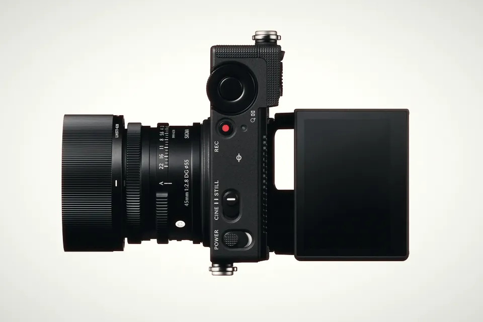 Top view of the Sigma FP2 with a 45mm lens, showing the CINE/STILL switch, the red REC button and the tilted rear screen
